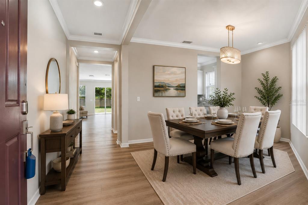 1192 Multiflora Loop Lutz, FL 33558 - Photo 7 of 32 a view of a dining room with furniture window and wooden floor