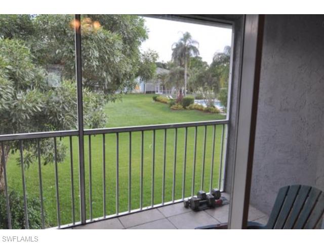 152 Cypress Way East, Unit 7 Naples, FL 34110 - Photo 9 of 21 a view of a balcony