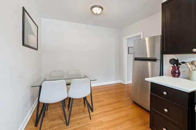 a view of a kitchen with chair and table