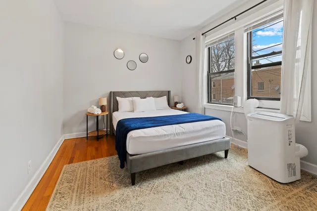 a bedroom with a bed and window