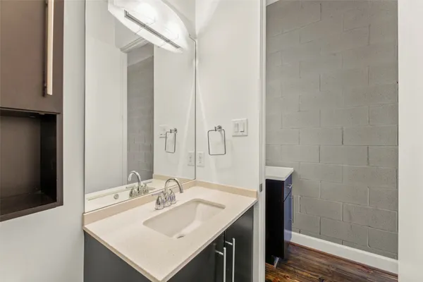 a bathroom with a sink and a mirror