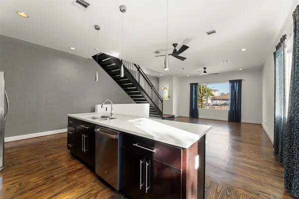 a view of entryway and hall with wooden floor