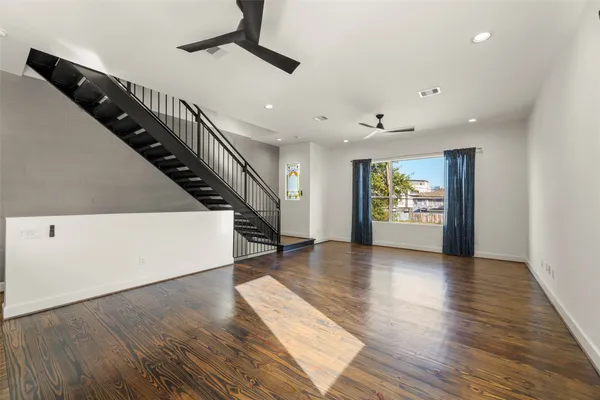 a view of an entryway with wooden floor