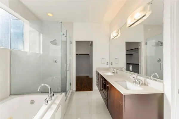 a bathroom with a sink double vanity and a mirror