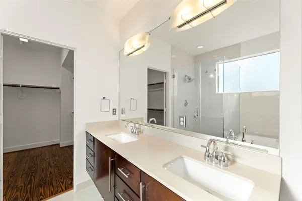 a bathroom with a tub and shower