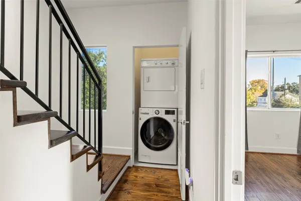 a view of an empty room and wooden floor