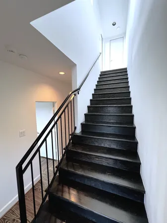 a front view of a building with garden