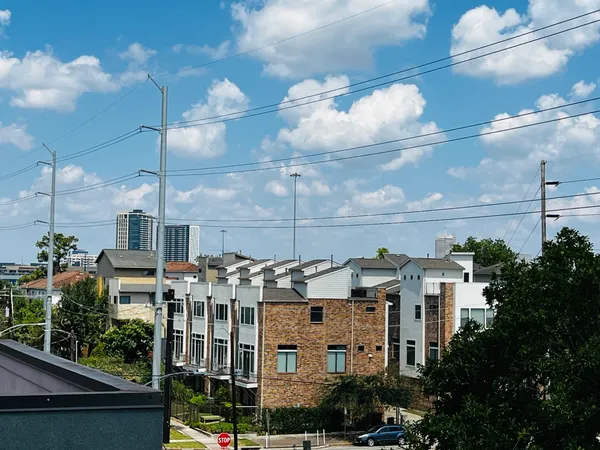 a view of a two chairs in a balcony