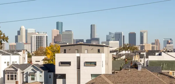 a bedroom with a bed and a view of the ocean