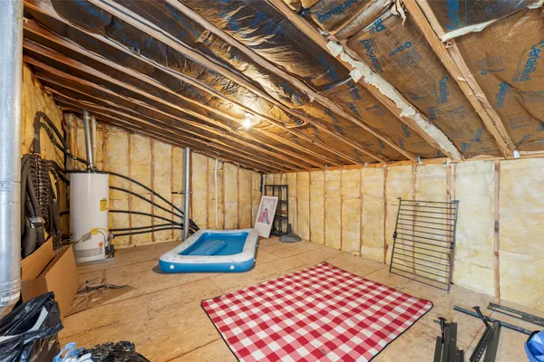 a front view of a house with a garden and patio