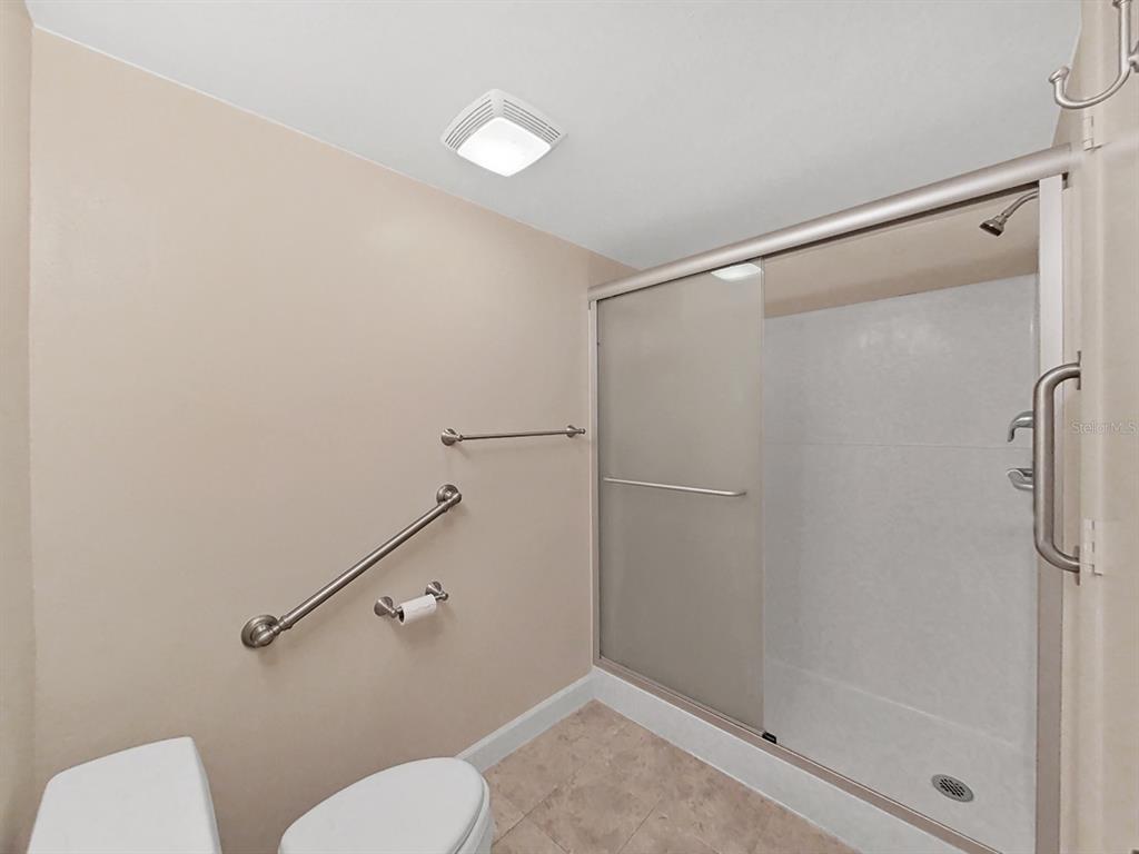 700 Starkey Road, Unit 644 Largo, FL 33771 - Photo 14 of 30 a bathroom with a shower and toilet