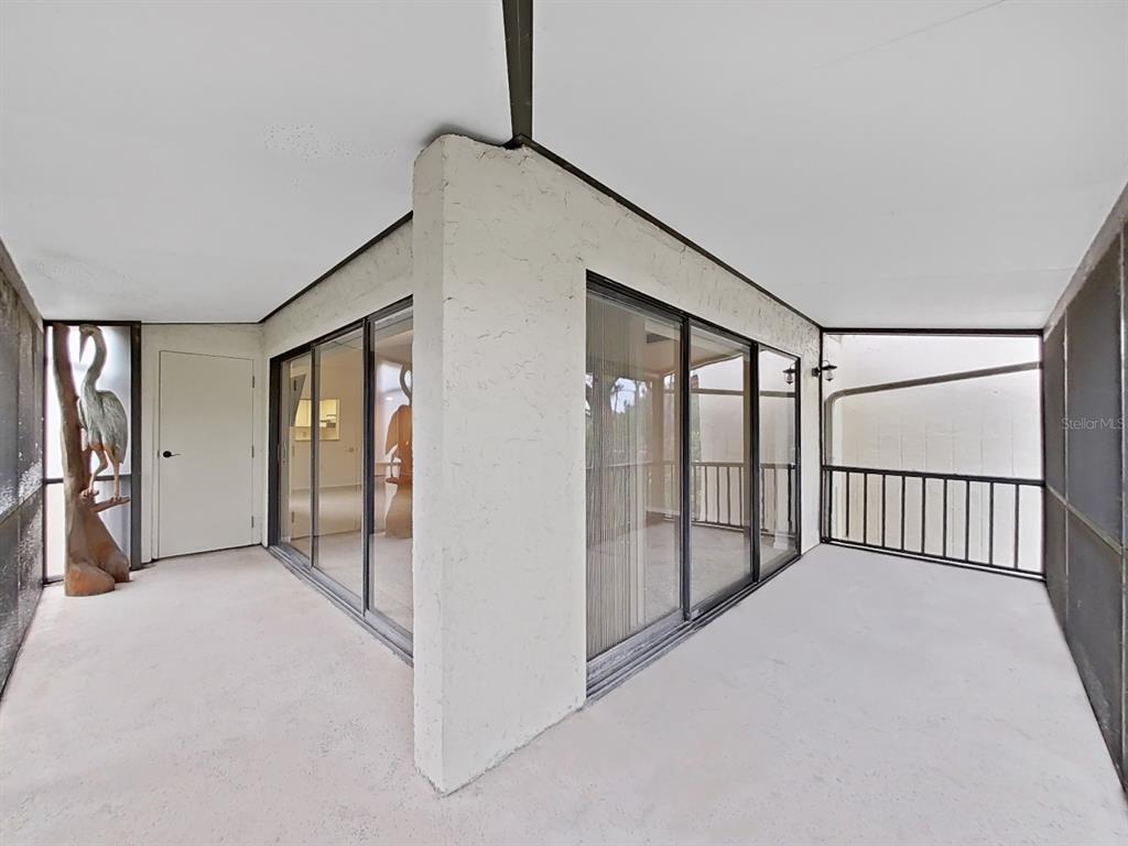 700 Starkey Road, Unit 644 Largo, FL 33771 - Photo 23 of 30 a view of a big room with windows and wardrobe