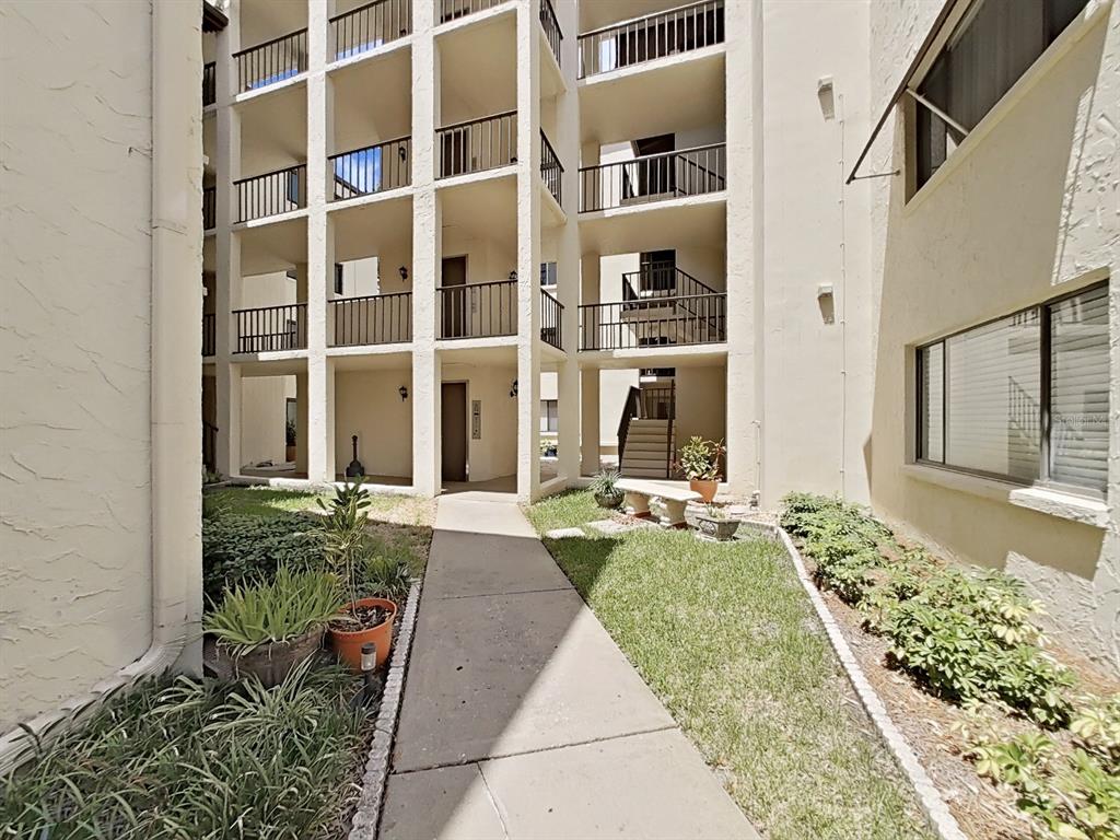 700 Starkey Road, Unit 644 Largo, FL 33771 - Photo 25 of 30 a front view of a house with garden