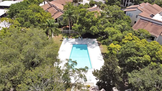 a aerial view of a house with a yard