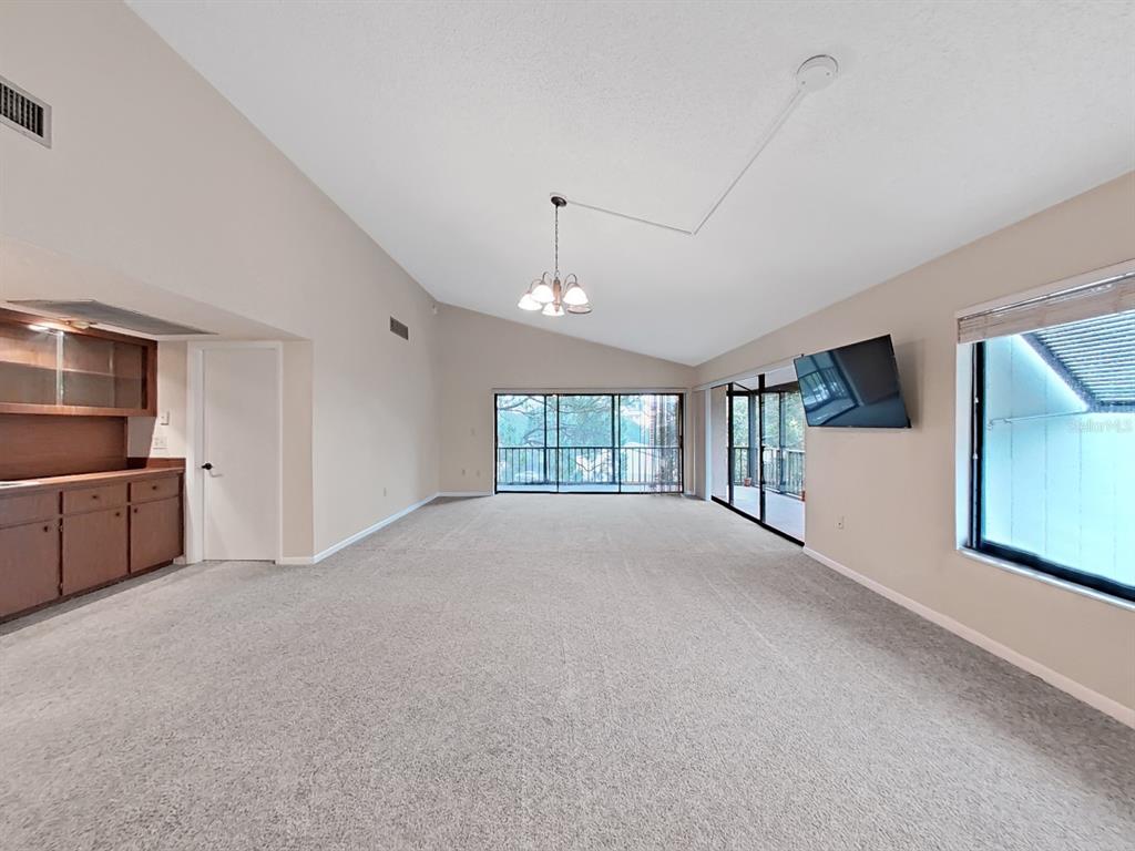 700 Starkey Road, Unit 644 Largo, FL 33771 - Photo 5 of 30 a view of a kitchen with a refrigerator cabinets and a window