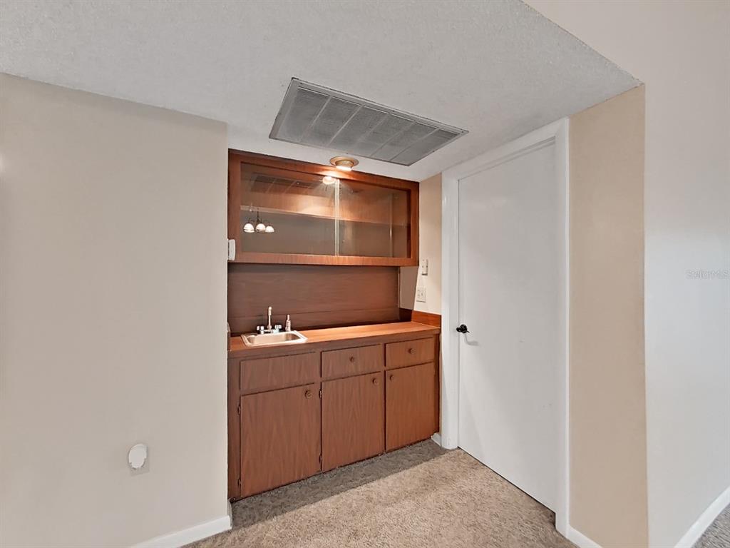 700 Starkey Road, Unit 644 Largo, FL 33771 - Photo 6 of 30 a room with a sink and cabinets