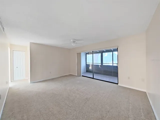 a view of an empty room with a fireplace