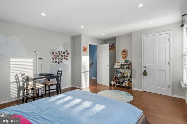 a bedroom with a bed and a dresser