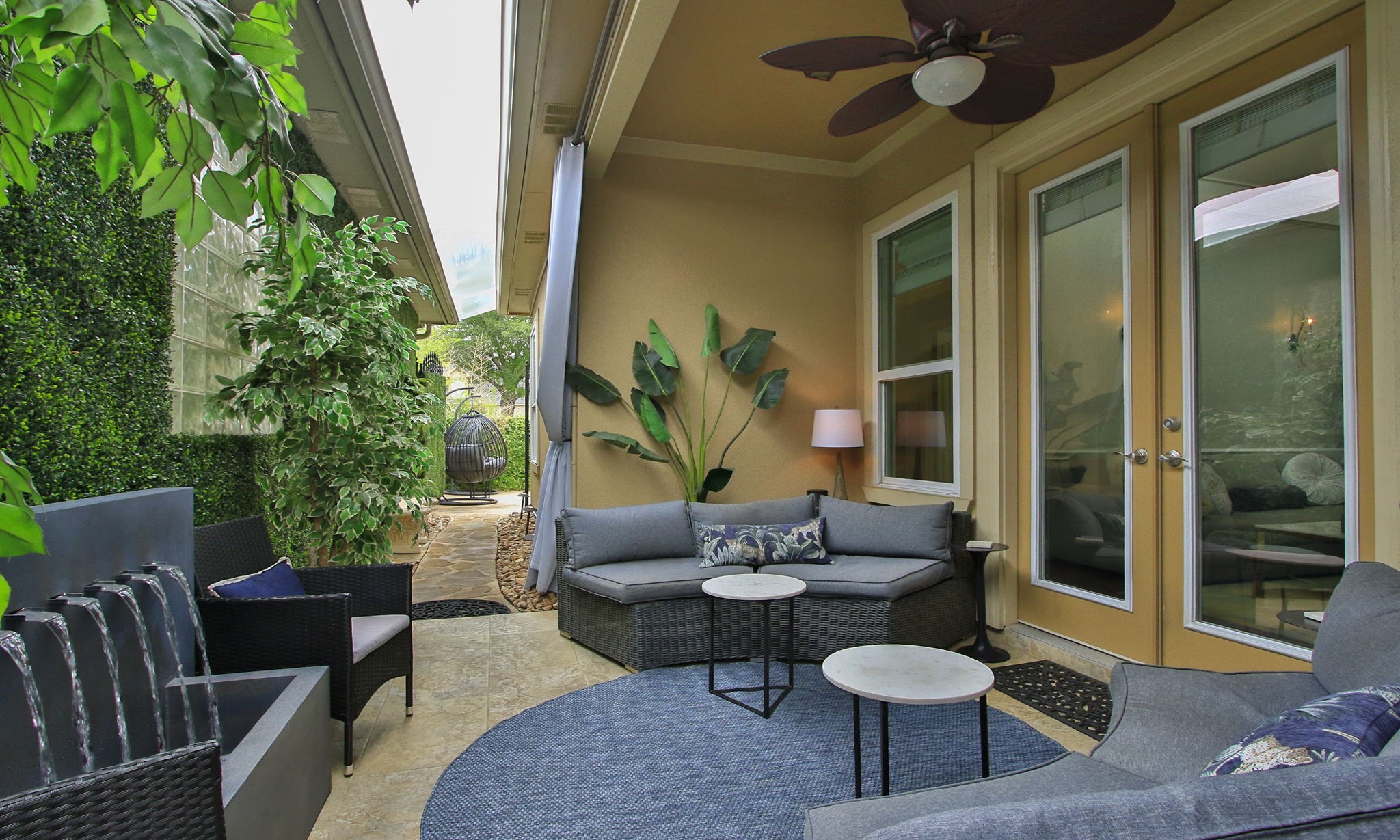 16610 Manningtree Lane Spring, TX 77379 - Photo 45 of 50 This relaxing patio is just off the Family room and has a Casablanca style ceiling fan. Many home furnishings including the fountains are offered for sale.