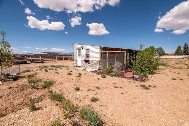 745 East 885 North Beaver, UT 84713 - Photo 38 of 50 View of yard featuring exterior structure, an outbuilding, and a mountain view
