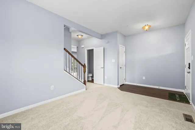 a view of a hallway with staircase