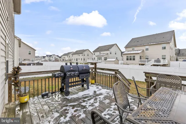 a view of a house with a snow in the background