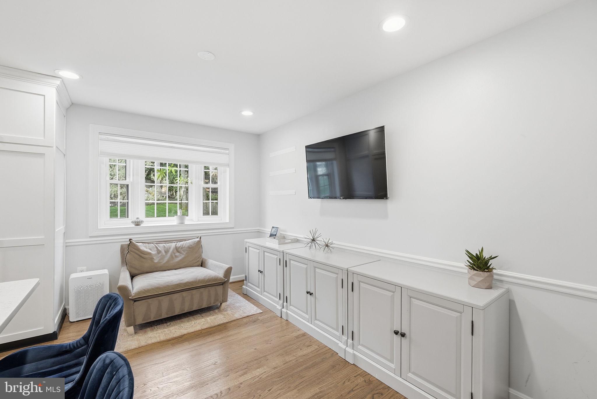9503 Rockport Road Vienna, VA 22180 - Photo 14 of 48 a spacious bedroom with a bed a couch and a flat screen tv