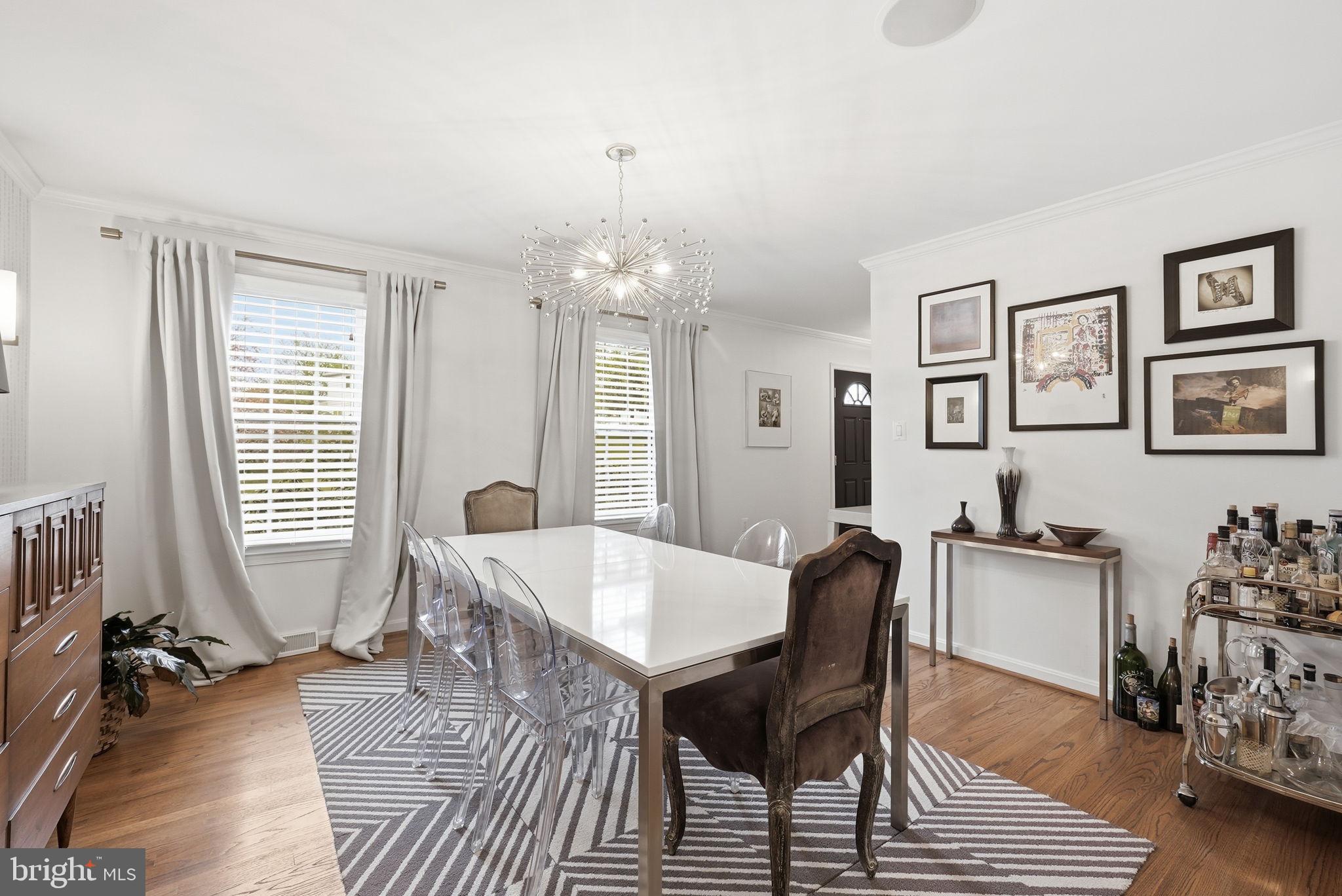 9503 Rockport Road Vienna, VA 22180 - Photo 16 of 48 a view of a dining room with furniture and chandelier