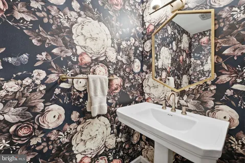 a bathroom with a sink and mirror