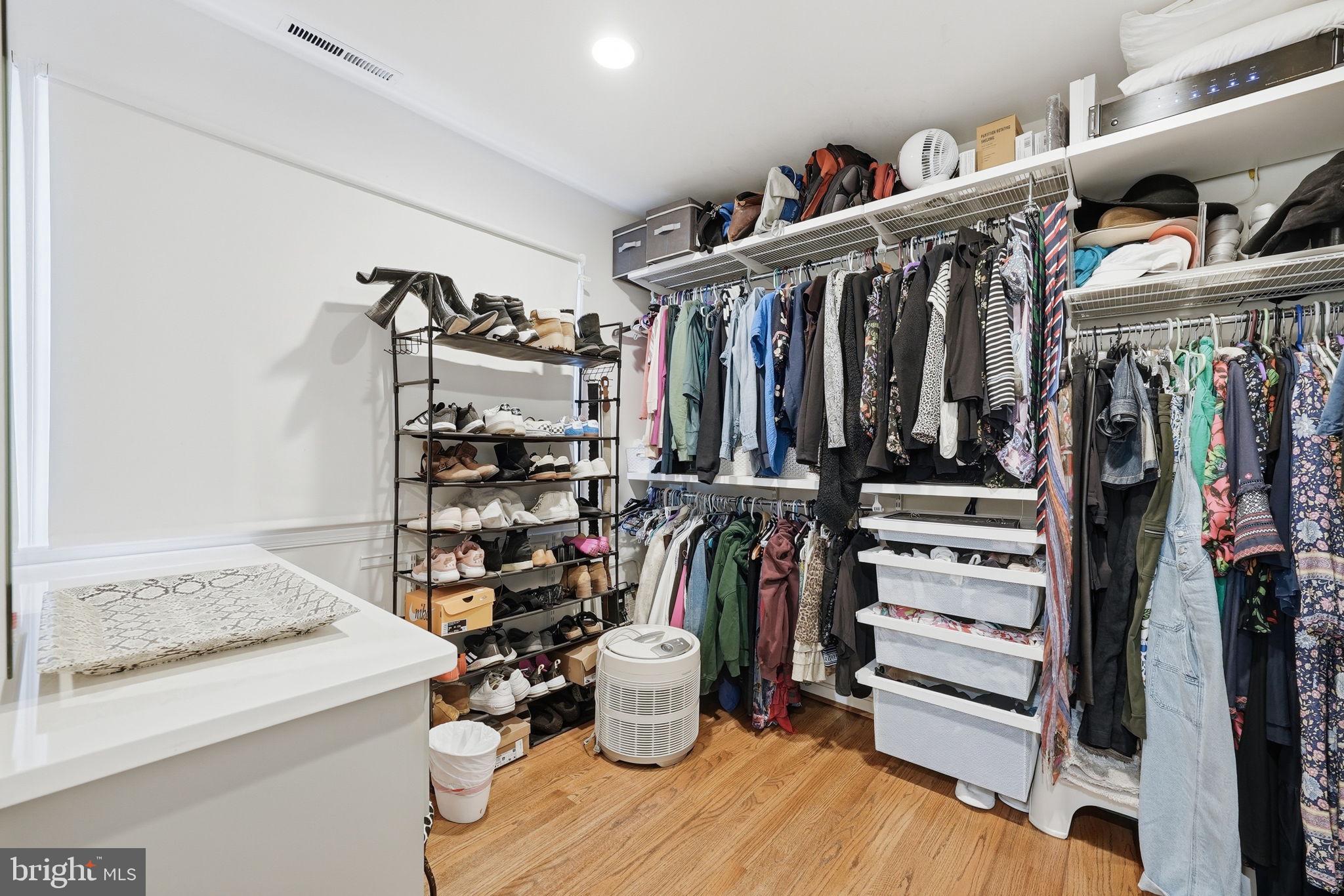 9503 Rockport Road Vienna, VA 22180 - Photo 20 of 48 a view of walk in closet with clothes and shoes