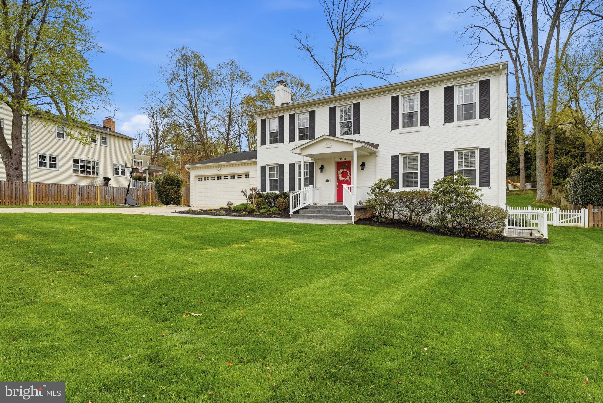 9503 Rockport Road Vienna, VA 22180 - Photo 2 of 48 a front view of a house with garden
