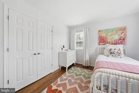 a spacious bedroom with a bed and a couch