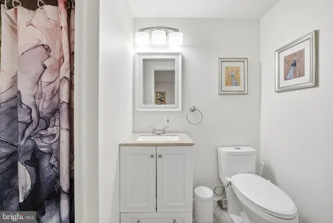 a bed room with a bed mirror and window