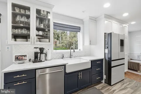 a kitchen with a sink stove and refrigerator