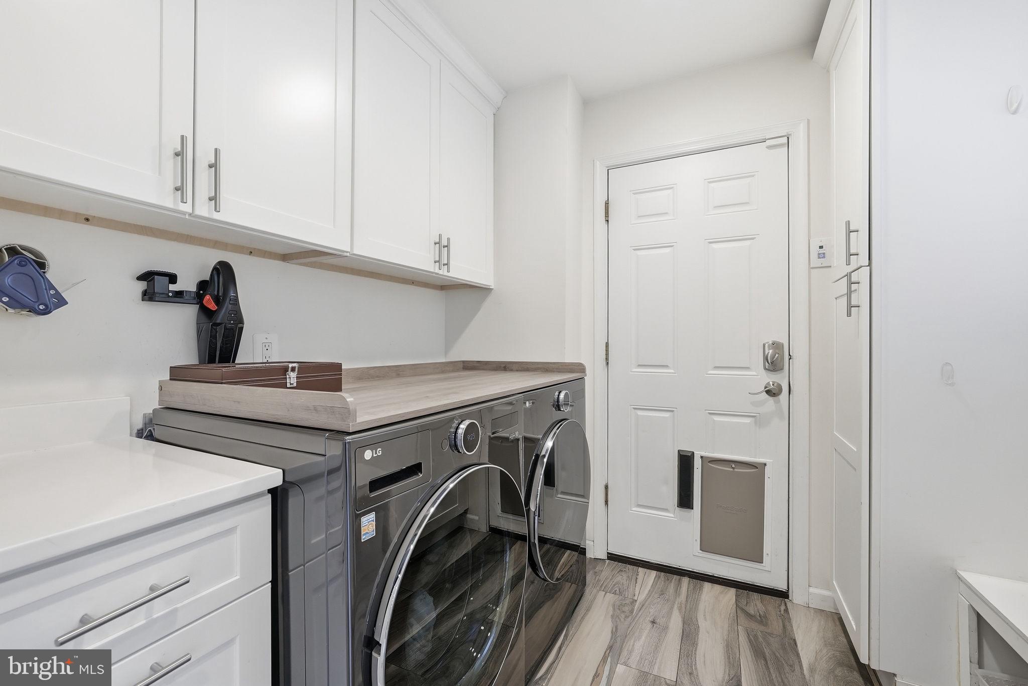 9503 Rockport Road Vienna, VA 22180 - Photo 9 of 48 a utility room with dryer and washer