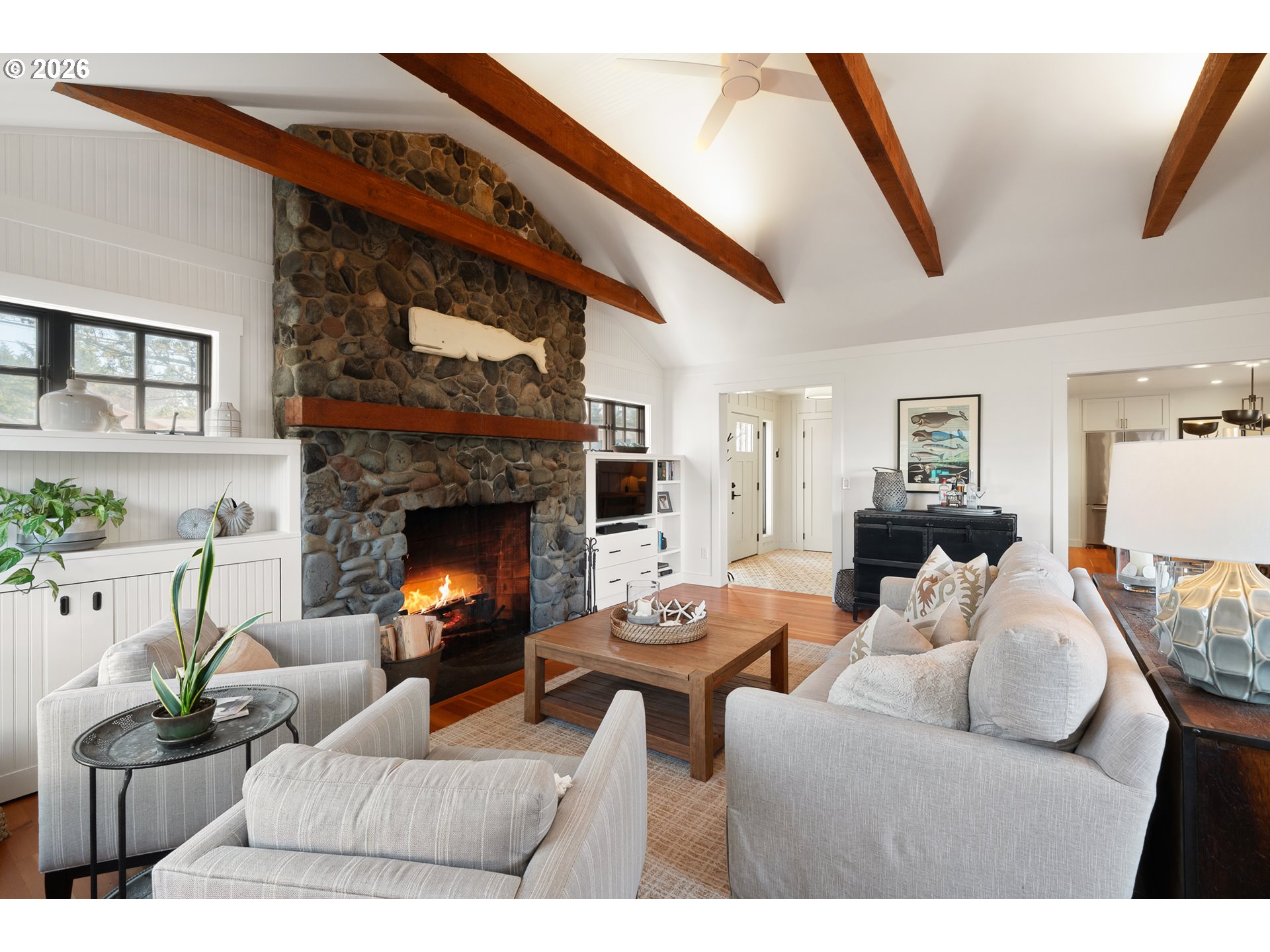 108 West Madison Street Cannon Beach, OR 97110 - Photo 15 of 45 a living room with furniture and a fireplace