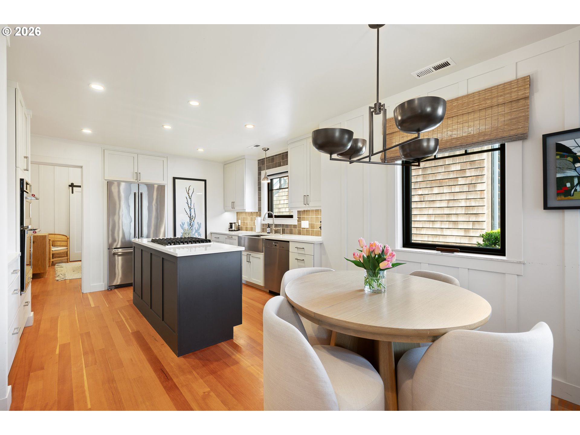 108 West Madison Street Cannon Beach, OR 97110 - Photo 22 of 45 a kitchen with a sink stainless steel appliances and dining table