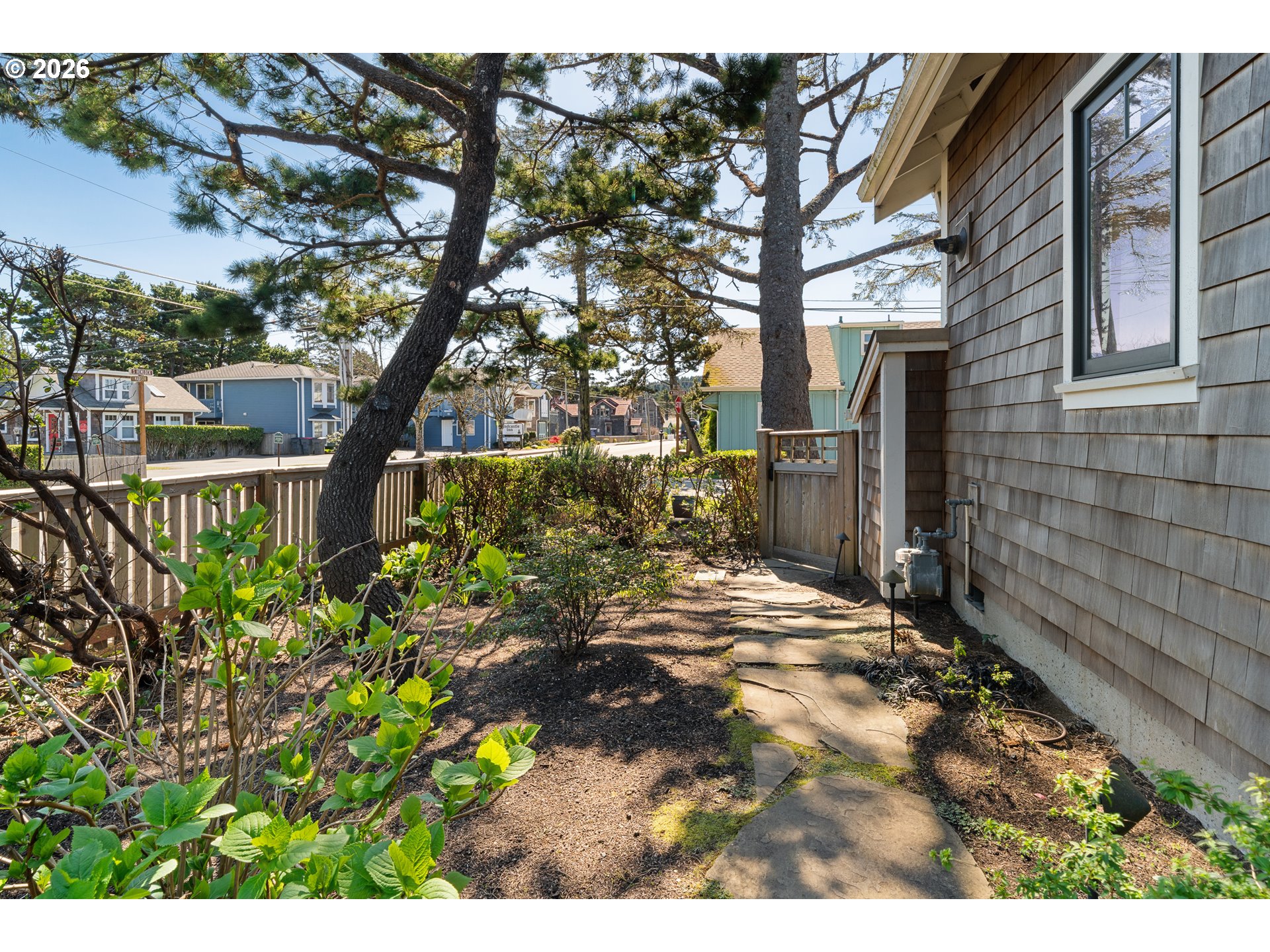 108 West Madison Street Cannon Beach, OR 97110 - Photo 3 of 45 a backyard of a house with lots of green space