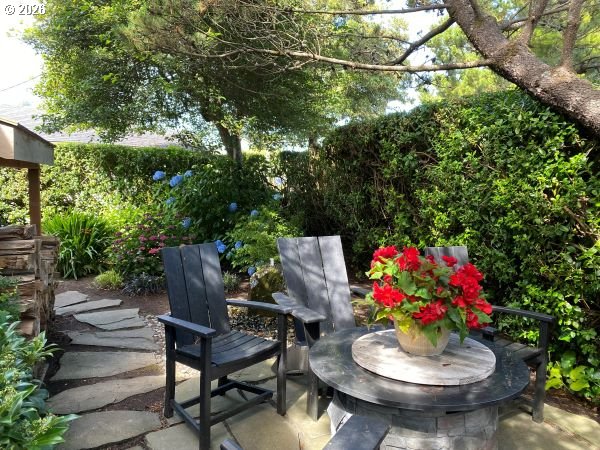 108 West Madison Street Cannon Beach, OR 97110 - Photo 5 of 45 a view of a porch with furniture and a potted plant