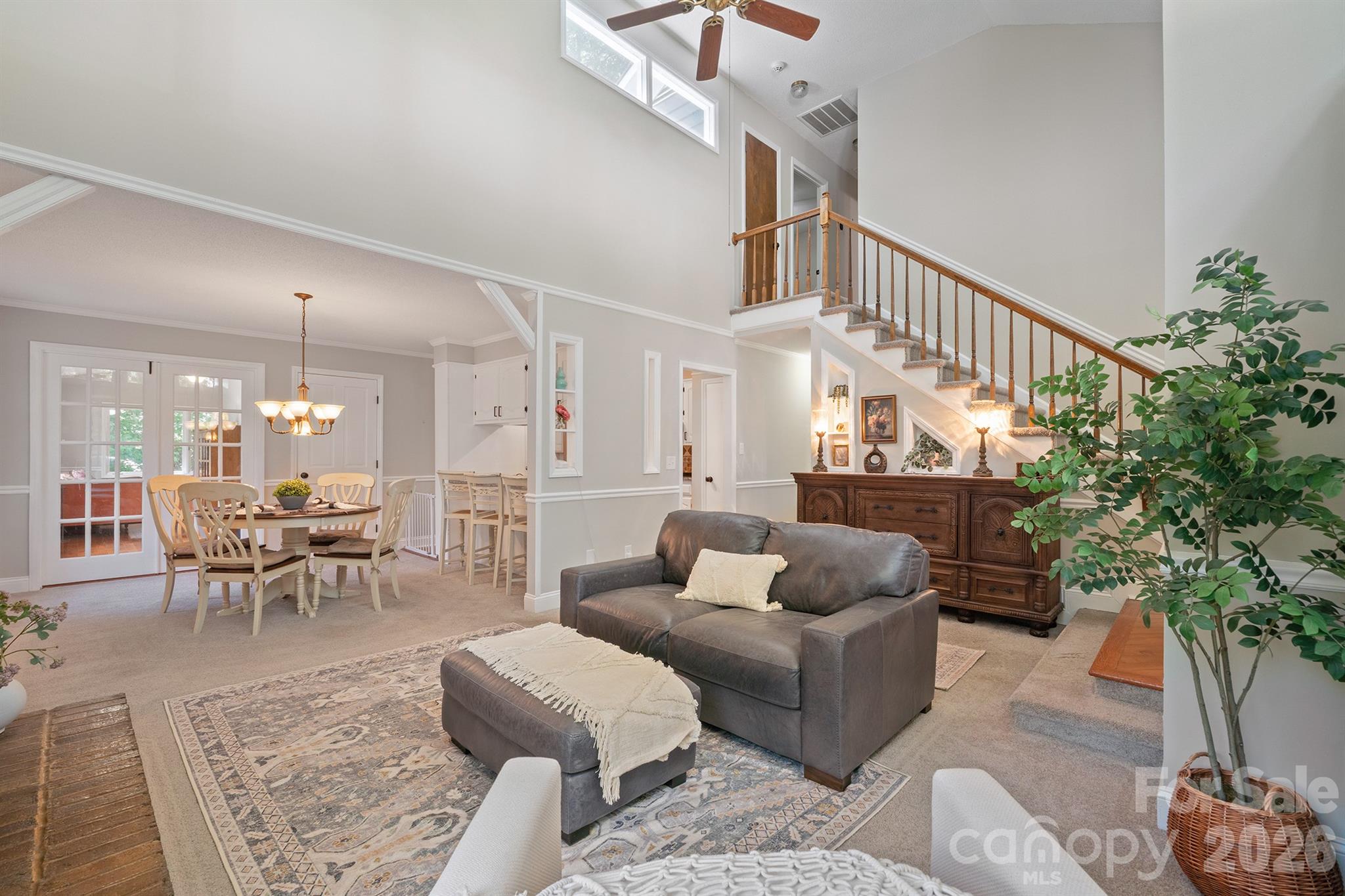 19017 Kailua Circle Tega Cay, SC 29708 - Photo 9 of 46 a living room with furniture potted plant and a chandelier