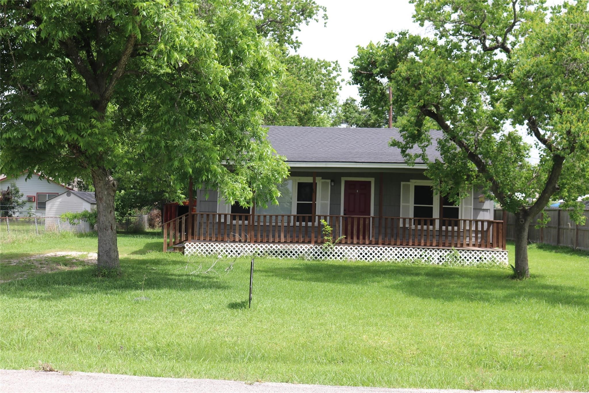 611 Nelson Street Crosby, TX 77532 - Photo 1 of 6 a front view of a house with a yard