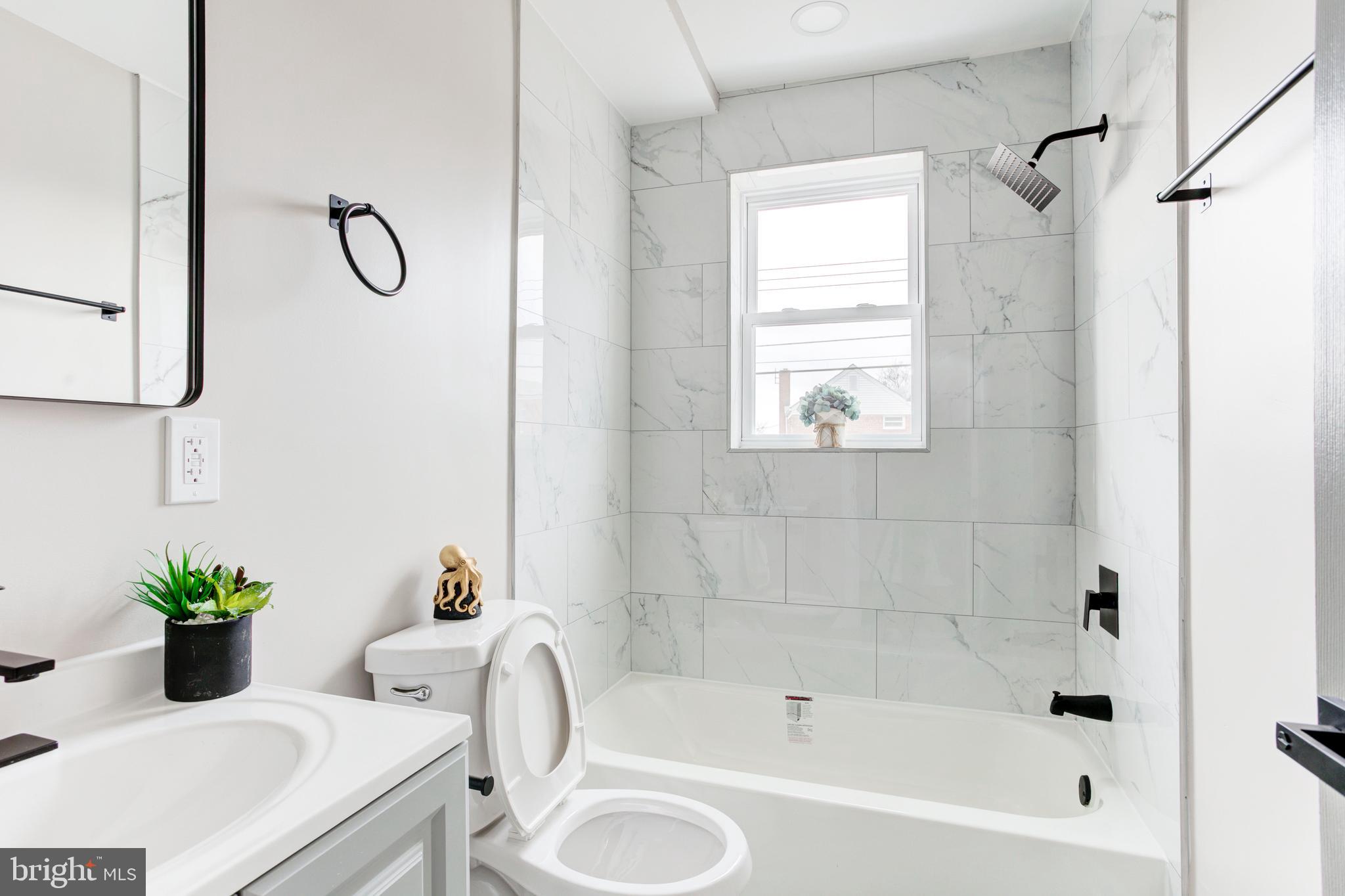 1012 Elton Avenue Baltimore, MD 21224 - Photo 11 of 30 a bathroom with a bathtub sink and toilet