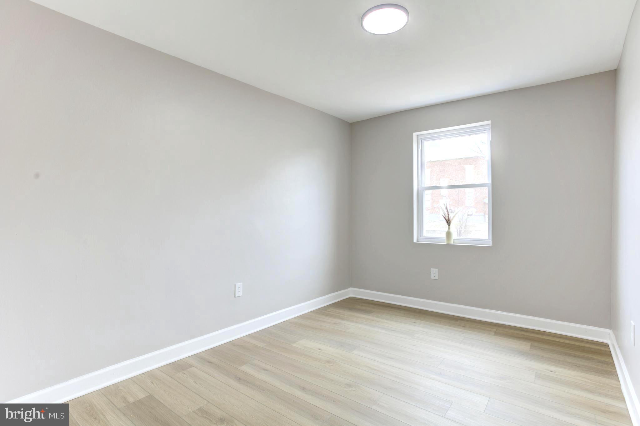 1012 Elton Avenue Baltimore, MD 21224 - Photo 16 of 30 an empty room with a window