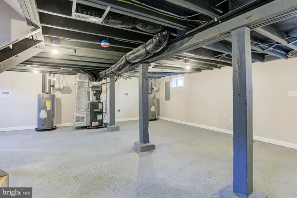 a view of empty room with wooden walls