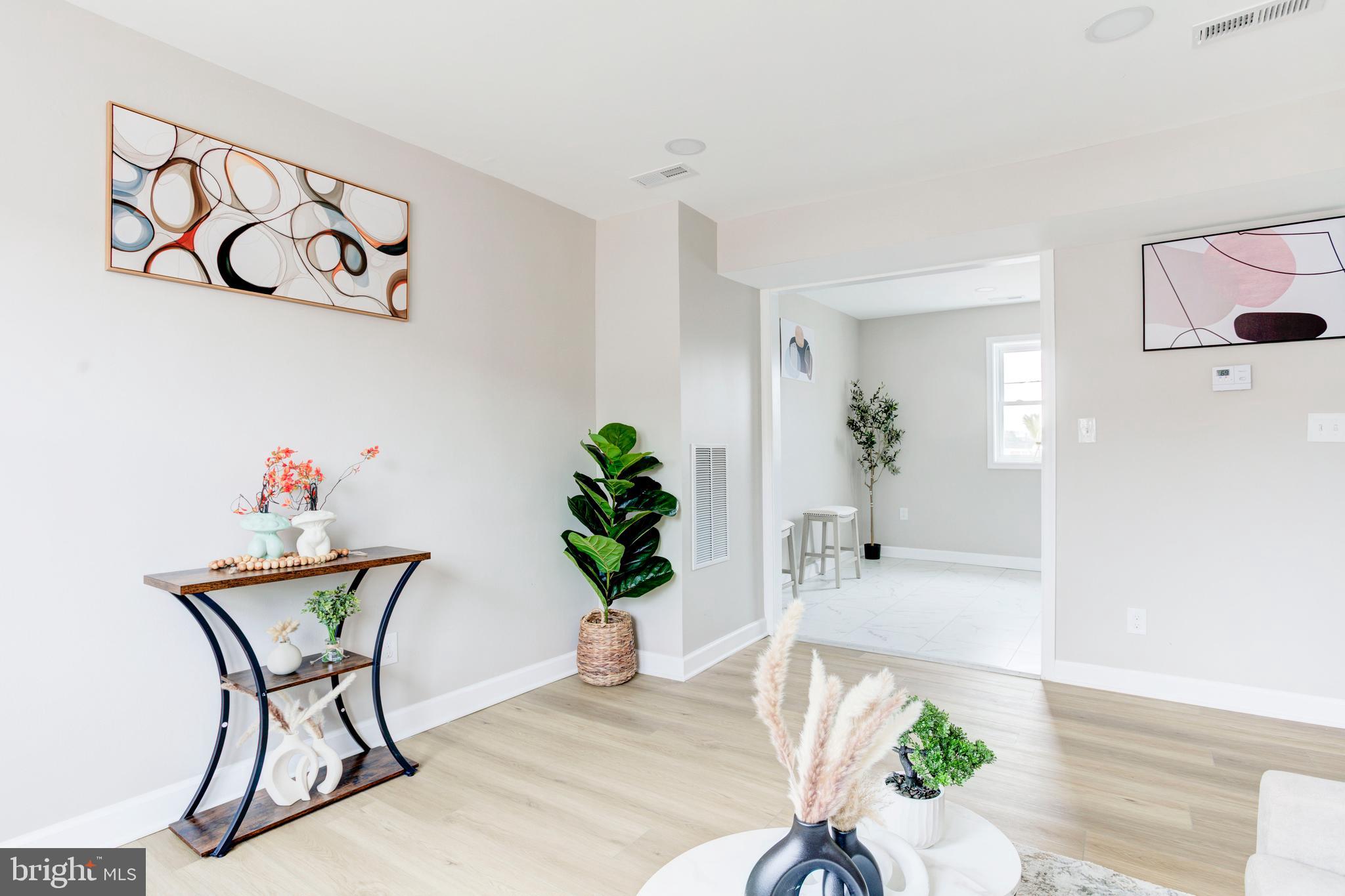1012 Elton Avenue Baltimore, MD 21224 - Photo 6 of 30 a dining room with furniture and wooden floor