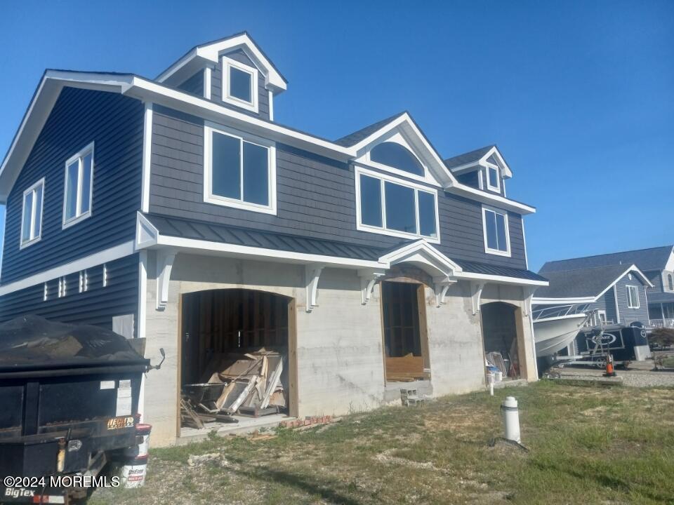 22 Mermaid Road Toms River, NJ 08753 - Photo 3 of 8 a front view of a house with a yard