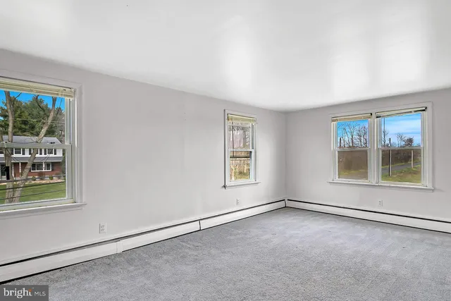 an empty room with windows