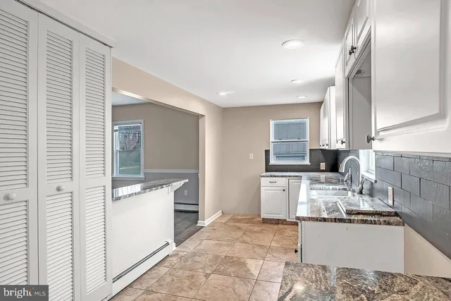 a kitchen with a sink stove and refrigerator