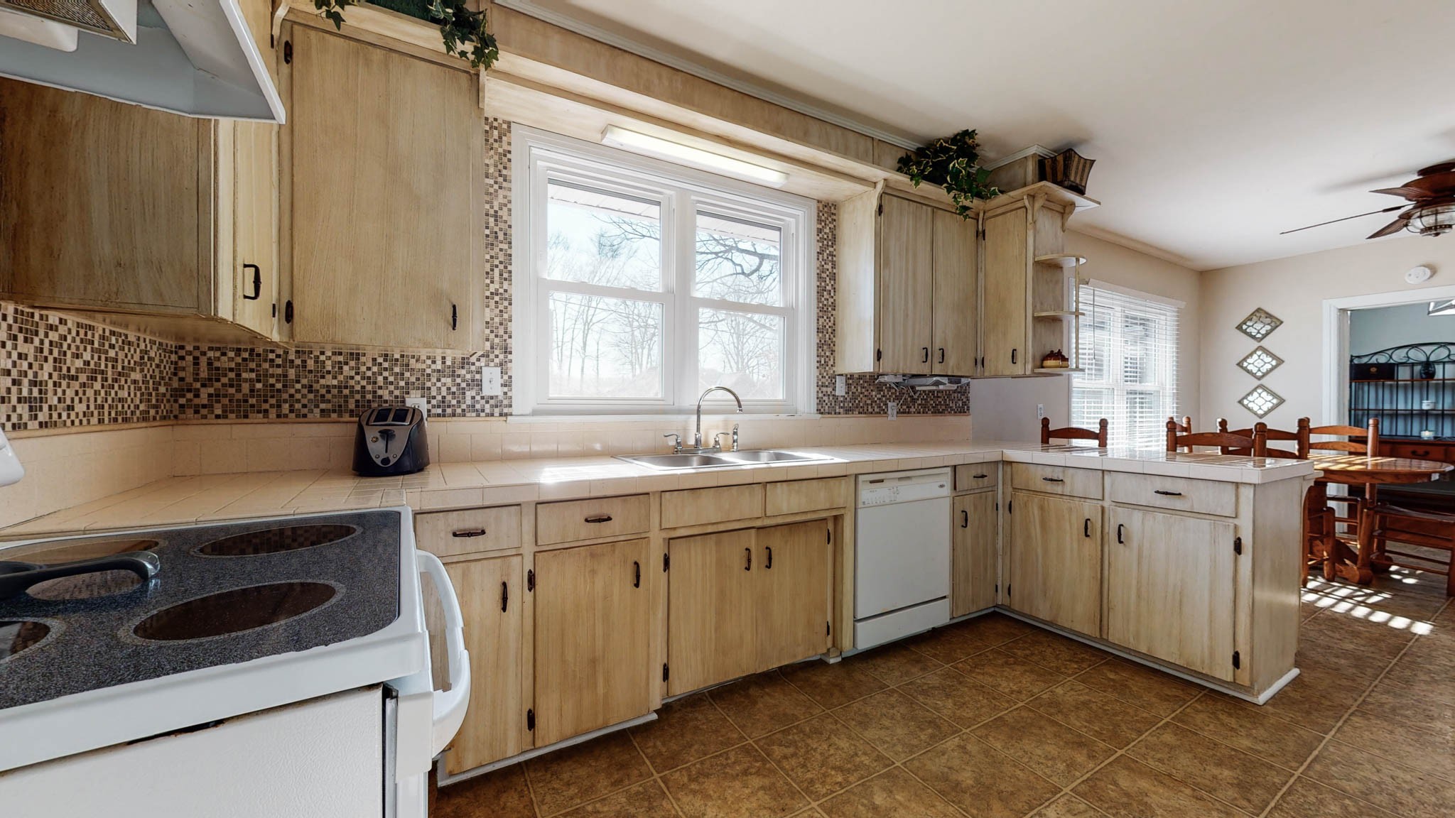 241 Hunt Creek Road Manchester, TN 37355 - Photo 7 of 33 a kitchen with a sink stove and cabinets
