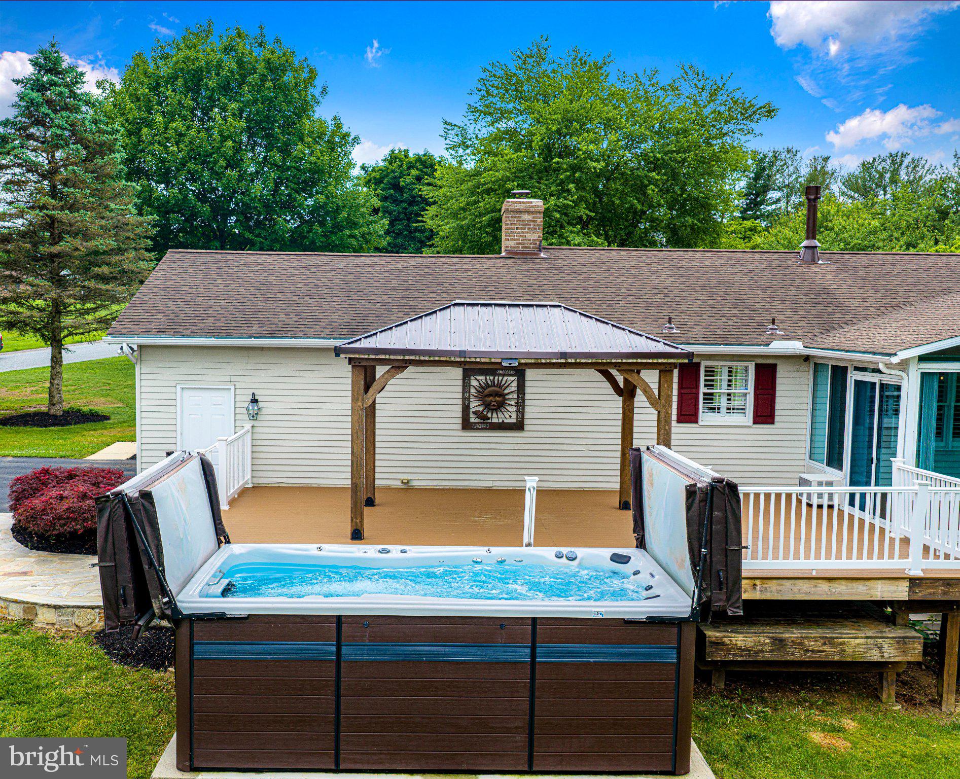 14300 Carroll Ridge Court Baldwin, MD 21013 - Photo 52 of 73 a backyard of a house with barbeque oven fire pit table and chairs